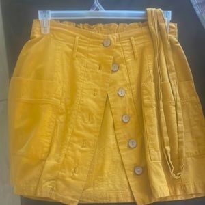 mustard yellow button up skirt with ribbon belt